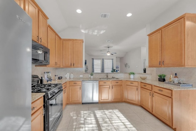 kitchen with visible vents, black appliances, light brown cabinets, a sink, and light tile patterned floors