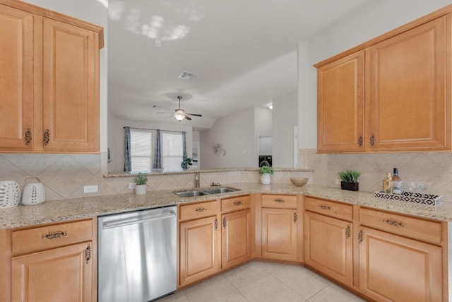 kitchen featuring light stone counters, light tile patterned floors, visible vents, a sink, and stainless steel dishwasher