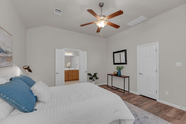 bedroom with visible vents, baseboards, wood finished floors, and a ceiling fan