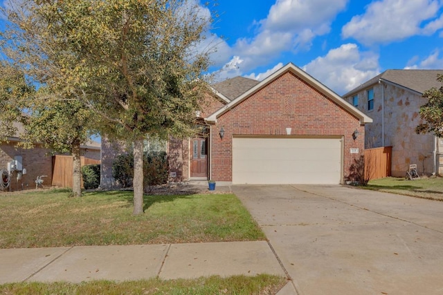 view of front facade featuring brick siding, an attached garage, a front yard, and fence