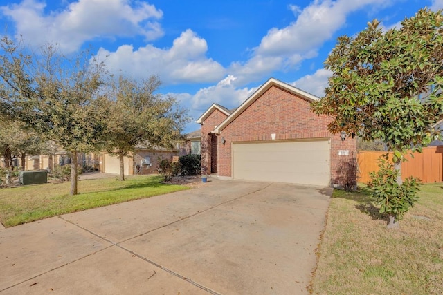 view of front of property featuring a front lawn, fence, concrete driveway, an attached garage, and brick siding