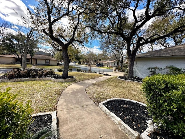 surrounding community featuring a lawn