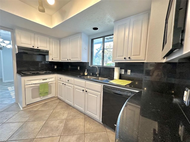 kitchen featuring under cabinet range hood, white cabinets, black appliances, and a sink