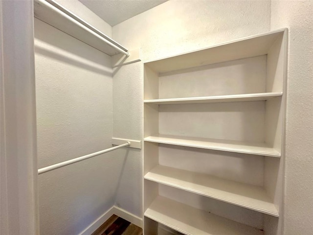 11740 D K Ranch Rd, Austin, TX 78759 - walk in closet with wood finished floors