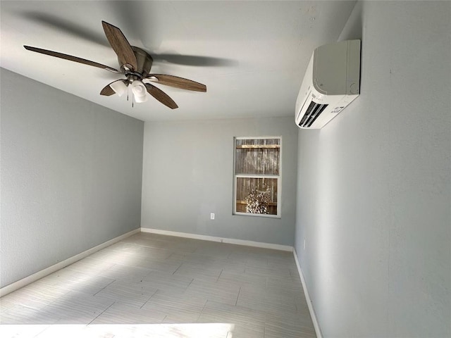 spare room featuring a ceiling fan, baseboards, and a wall mounted AC