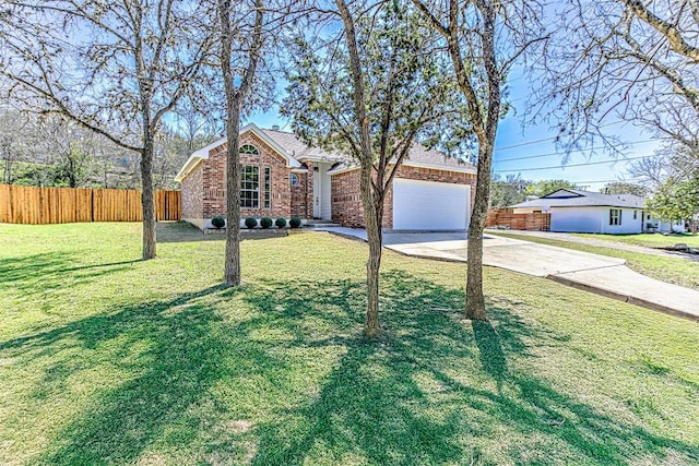 ranch-style home with fence, concrete driveway, a front yard, a garage, and brick siding