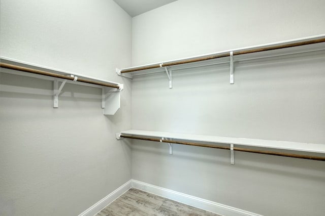 walk in closet featuring light wood-style floors