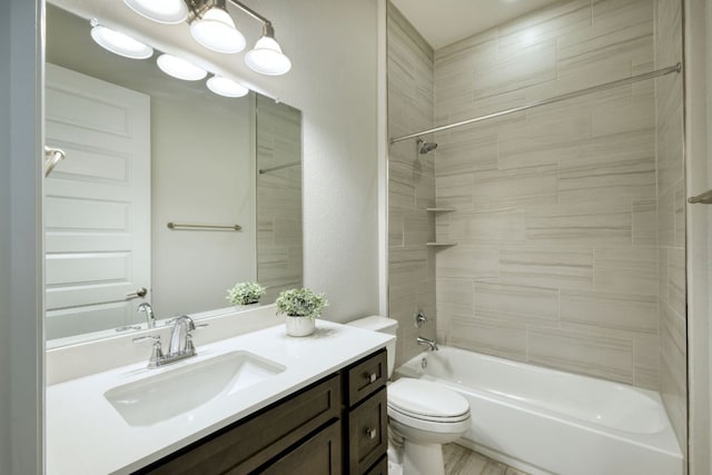 bathroom featuring vanity, toilet, and shower / washtub combination