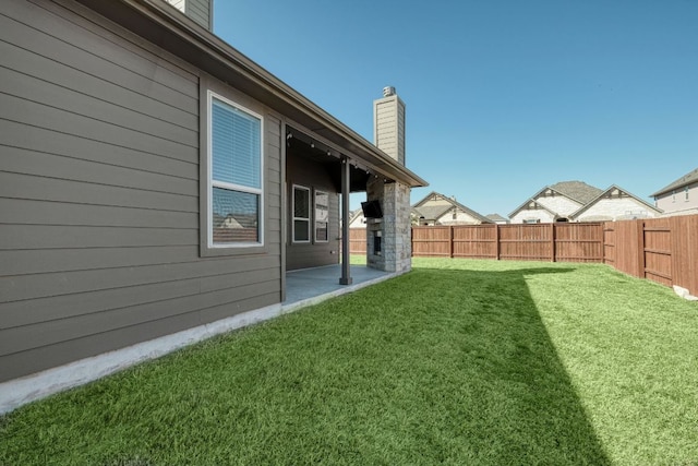 view of yard with a patio and a fenced backyard