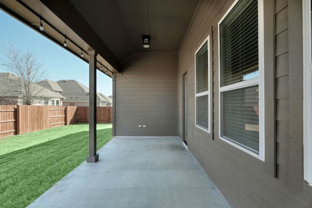 view of patio / terrace featuring fence