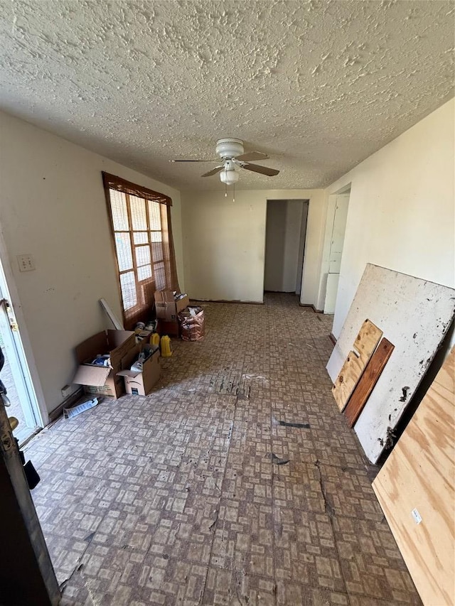 102 Masonic Dr, Elgin, TX 78621 - spare room with ceiling fan, brick patterned floors, and a textured ceiling