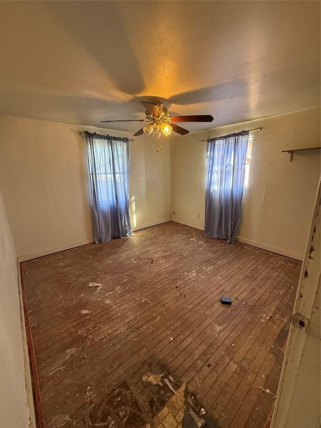 102 Masonic Dr, Elgin, TX 78621 - unfurnished room with hardwood / wood-style floors, ceiling fan, and plenty of natural light