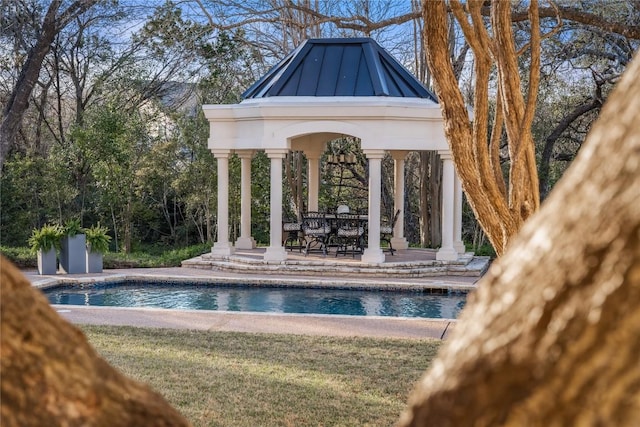 outdoor pool with a gazebo and a patio