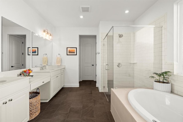 bathroom featuring a shower stall, a bath, double vanity, and visible vents