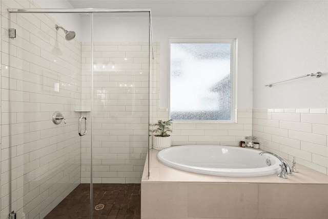 full bath with a garden tub, plenty of natural light, and a stall shower