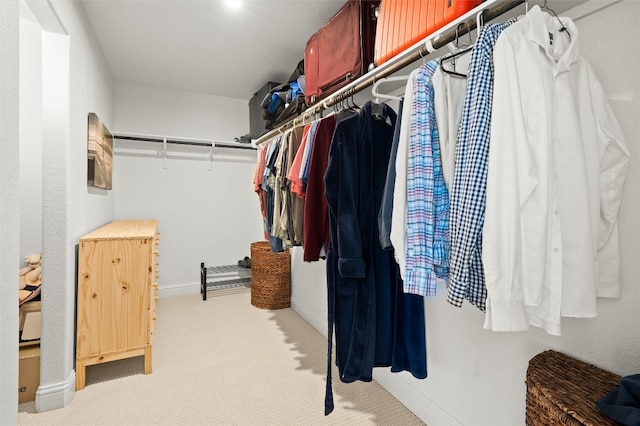 spacious closet featuring light carpet