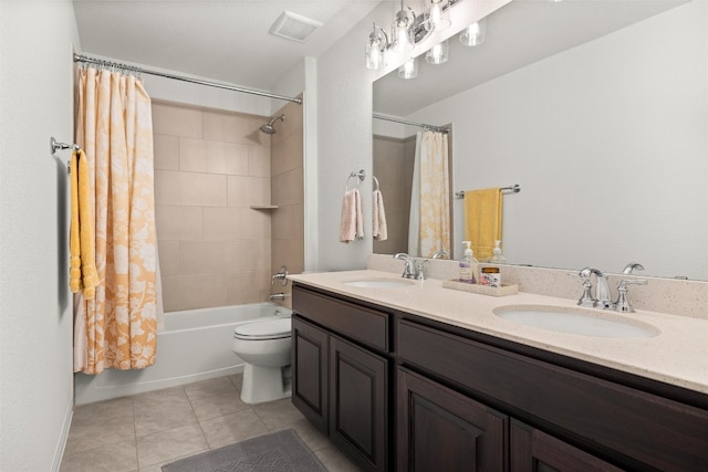 full bath with a sink, visible vents, double vanity, and tile patterned floors