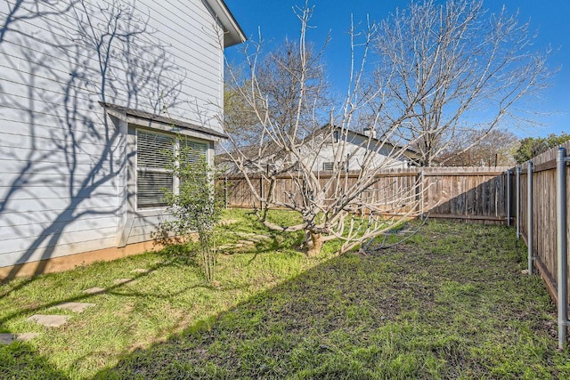 view of yard featuring a fenced backyard