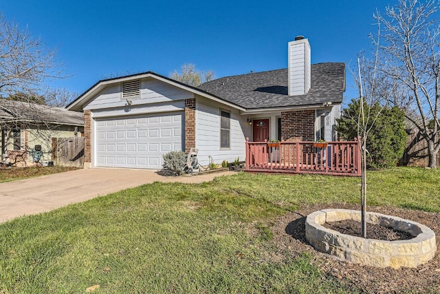 view of front of property featuring brick siding, concrete driveway, a front yard, a chimney, and a garage