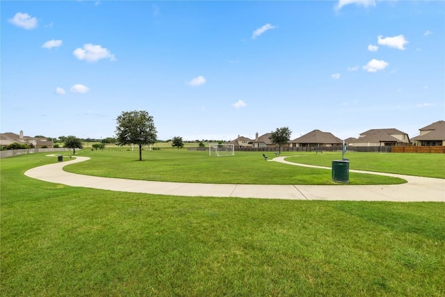 view of community featuring a residential view and fence