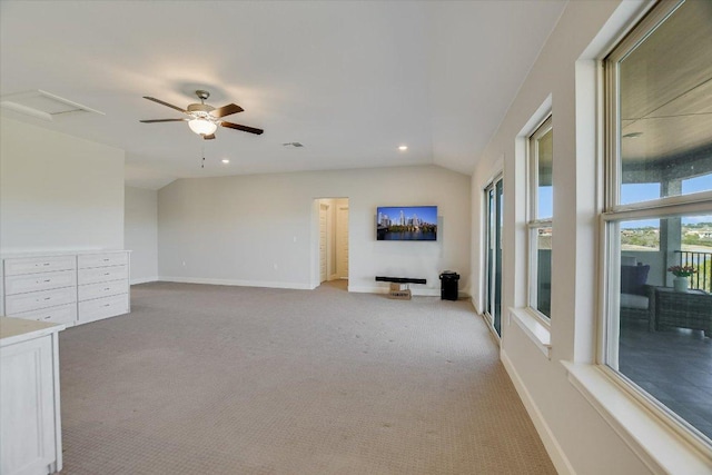 unfurnished room featuring vaulted ceiling, baseboards, visible vents, and light carpet