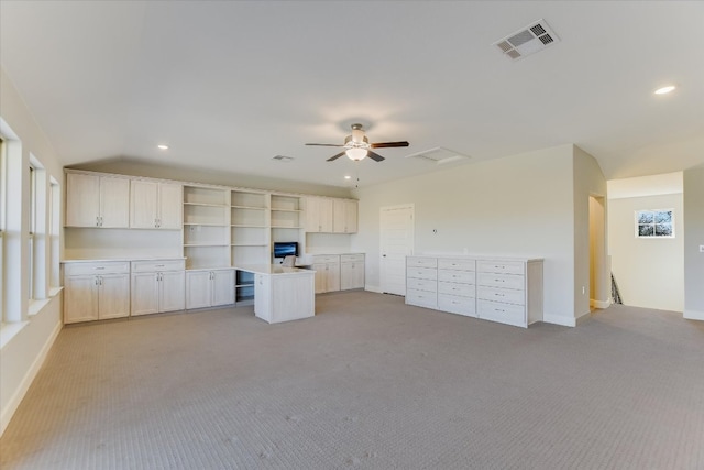 kitchen featuring visible vents, light colored carpet, vaulted ceiling, recessed lighting, and open shelves