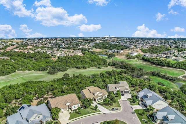 birds eye view of property with golf course view and a residential view