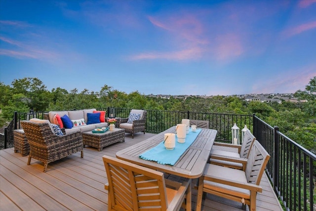 wooden deck featuring an outdoor living space and outdoor dining area