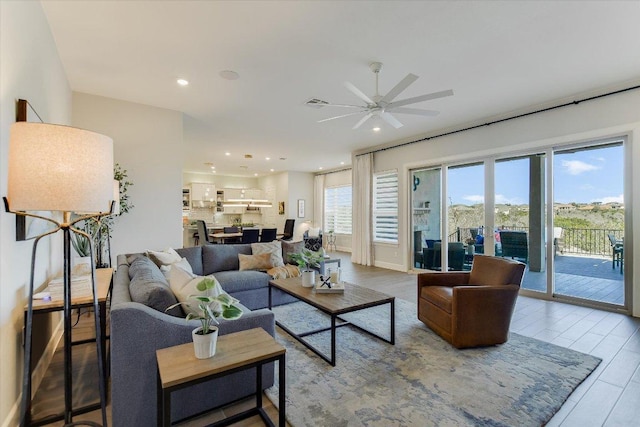 living room featuring visible vents, recessed lighting, ceiling fan, and wood finished floors