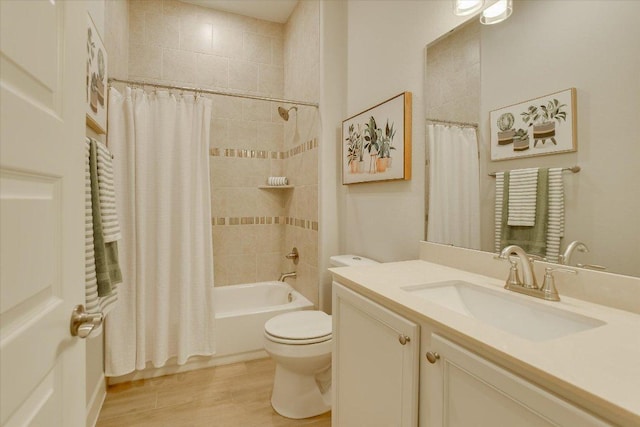 bathroom with shower / bathtub combination with curtain, toilet, wood finished floors, and vanity