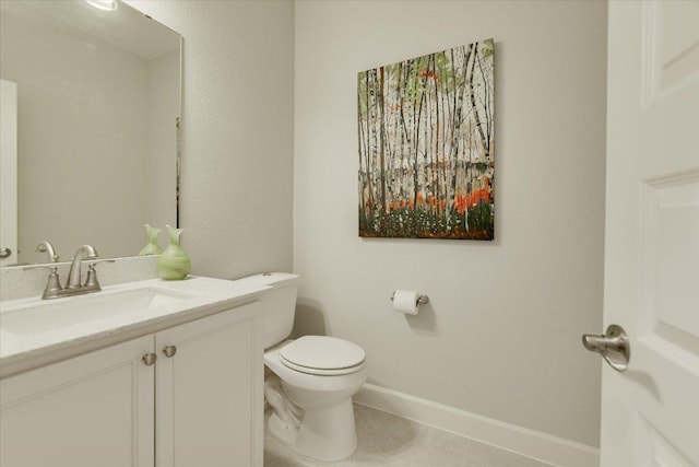 half bath featuring tile patterned floors, baseboards, toilet, and vanity