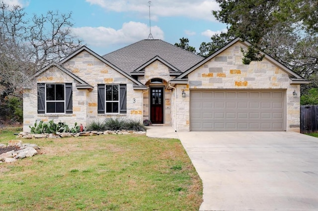 view of front of home featuring a front lawn, stone siding, roof with shingles, concrete driveway, and an attached garage