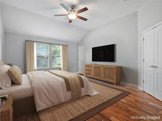 802 Wood Mesa Dr, Round Rock, TX 78665 - bedroom with wood finished floors, lofted ceiling, a ceiling fan, and a closet
