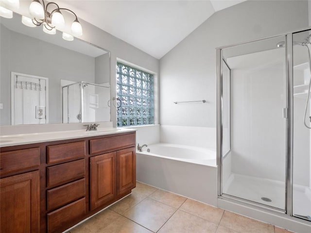 802 Wood Mesa Dr, Round Rock, TX 78665 - full bathroom featuring a shower stall, double vanity, tile patterned flooring, lofted ceiling, and a garden tub
