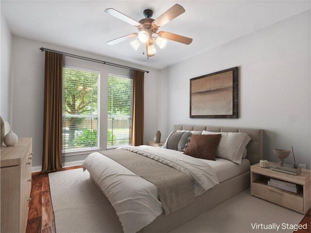 802 Wood Mesa Dr, Round Rock, TX 78665 - bedroom featuring wood finished floors and a ceiling fan