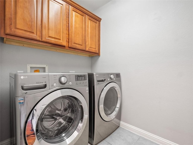802 Wood Mesa Dr, Round Rock, TX 78665 - laundry room featuring cabinet space, washing machine and dryer, and light tile patterned floors