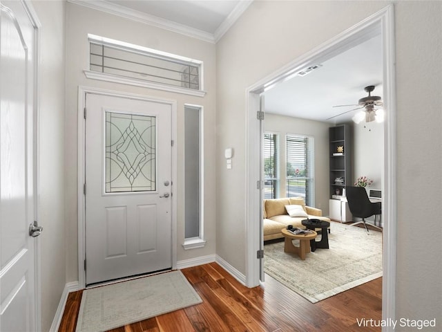 802 Wood Mesa Dr, Round Rock, TX 78665 - foyer featuring dark wood-type flooring, ornamental molding, and a ceiling fan