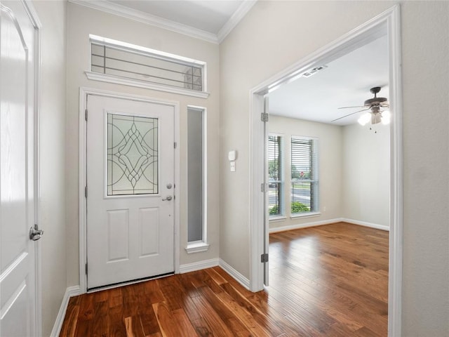802 Wood Mesa Dr, Round Rock, TX 78665 - foyer entrance featuring dark wood-style floors, ornamental molding, and ceiling fan