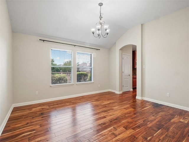 802 Wood Mesa Dr, Round Rock, TX 78665 - unfurnished room featuring arched walkways, a chandelier, wood finished floors, and lofted ceiling
