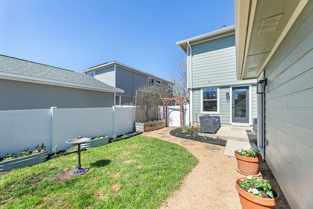 view of yard with a gate and fence