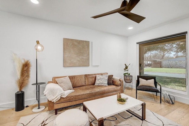 living area with recessed lighting, light wood-type flooring, and ceiling fan