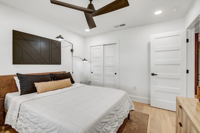 bedroom featuring recessed lighting, visible vents, baseboards, and light wood finished floors