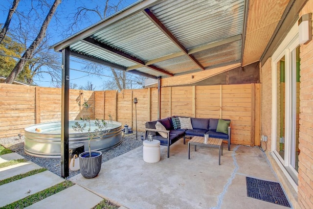 view of patio / terrace featuring visible vents, an outdoor living space, and a fenced backyard