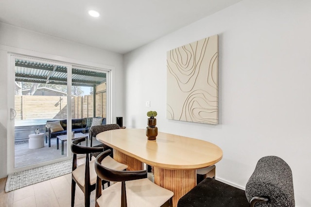 dining space featuring recessed lighting, light wood-type flooring, and baseboards