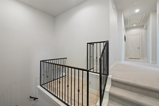 staircase with attic access, baseboards, carpet, and recessed lighting