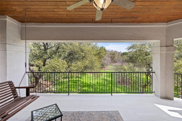 view of patio / terrace featuring a balcony and ceiling fan