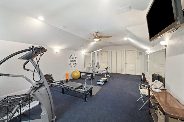 exercise area featuring a ceiling fan and vaulted ceiling