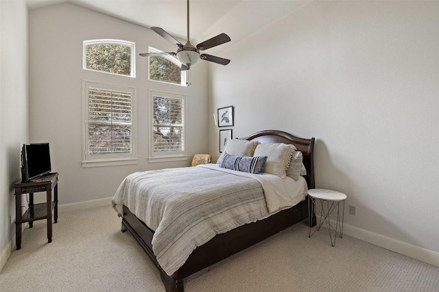 bedroom with light carpet, ceiling fan, and baseboards