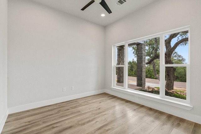 unfurnished room featuring visible vents, recessed lighting, light wood finished floors, baseboards, and ceiling fan