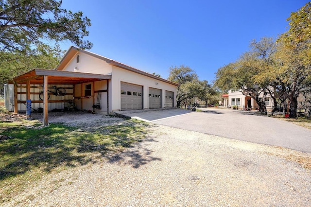 view of side of property featuring an outbuilding